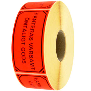 Etikett "Hantera Varsamt..."