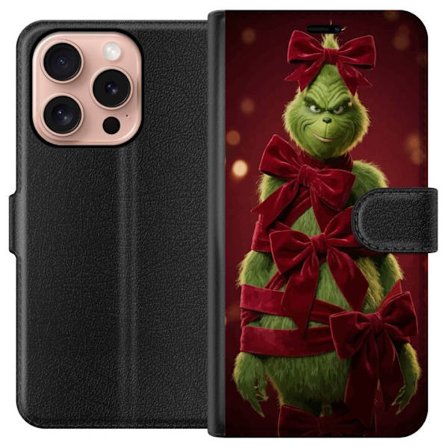 Yhteensopiva Lompakkokotelo Apple Apple iPhone 16 Pro Grinchi-hahmo koristeltu punaisilla samettinauhoilla juhlavassa studiossa, leikkisällä ja humo