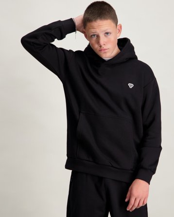 Hummel hmlJR LOOSE HOODIE BEE Noir Sweats à capuche Garçon - Kids Brand Store