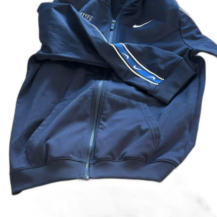 Blå Nike kofta och byxa