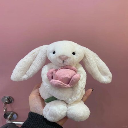 Jellycat kosedyr, mykt og komfortabelt, for barn, Valentinsdagsgaver, samleobjekter, med en 18 cm kanin som holder rosa blomster.