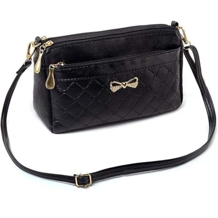 Svart, liten fyrkantig handväska i mjukt syntetiskt läder lämplig för vardagligt bruk