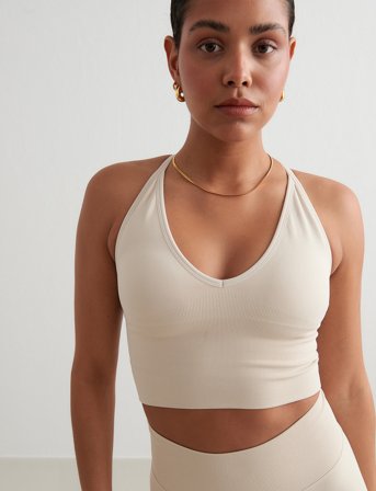 aim ́n Shape Seamless Cross Back Bralette - Beige - XL