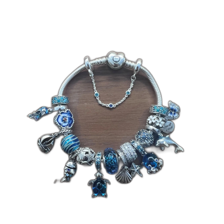 Pandora armband i silver med blå/hav berlocker