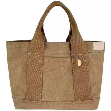 ING Tämä khakin värinen kangaskassi, jossa on useita lokeroita, sisältää kultaisen riipuksen ja on riittävän tilava kirjoille ja arjen tarvikkeille.