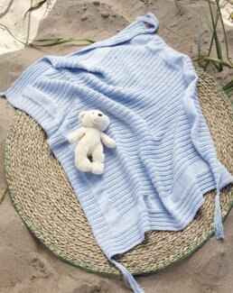 Beskrivning Omlottkofta, mössa och filt