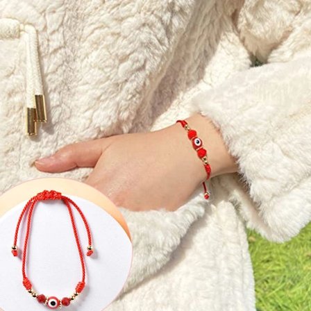 Onda armband med ont öga rött