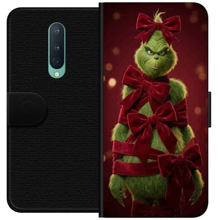 Yhteensopiva Lompakkokotelo OnePlus OnePlus 8 Grinchi-hahmo koristeltu punaisilla samettinauhoilla juhlavassa studiossa, leikkisällä ja humoristisel