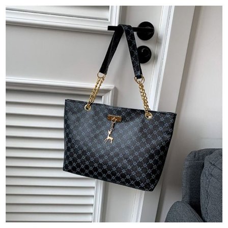 Musta olkalaukku ostoskassi