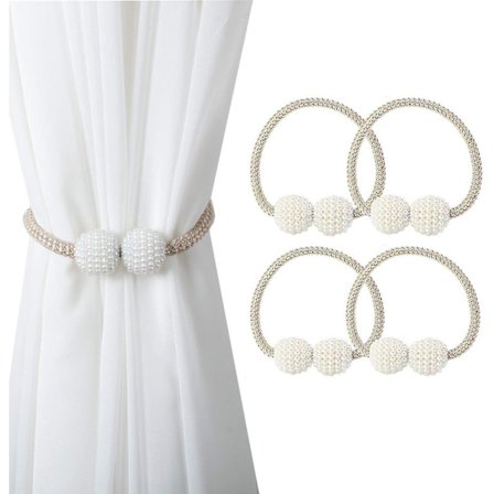 Et sett med 4 champagnefargede magnetiske gardinklemmer med små