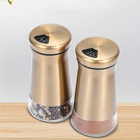 Salt- og peberbøsser, inklusive rustfri stål shaker og dispensere, samt en sukkerskål.