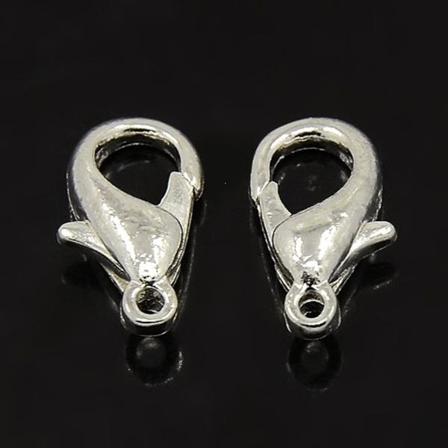 50 kpl. 14 mm. pitkät hummerilukot (3 värivaihtoehtoa) silverpläterade 14 mm.