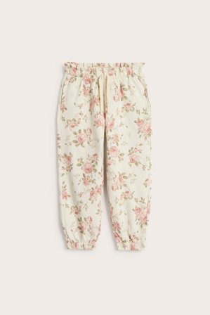 Newbie | Kukkakuvioiset housut | Vaaleanbeige