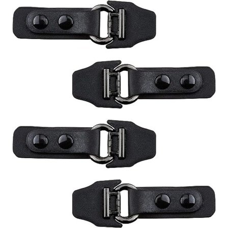 Sett med 4 par sorte metallspenner i skinn til klær, sying