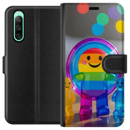Yhteensopiva Lompakkokotelo Sony Xperia 10 IV Regnbågsfärgad leksaksfigur med glatt ansikte och färgglada cirklar i lekfull studioillustration