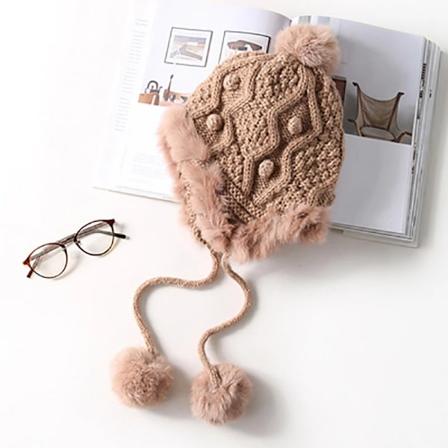 Stickad ullmössa för öronsskydd