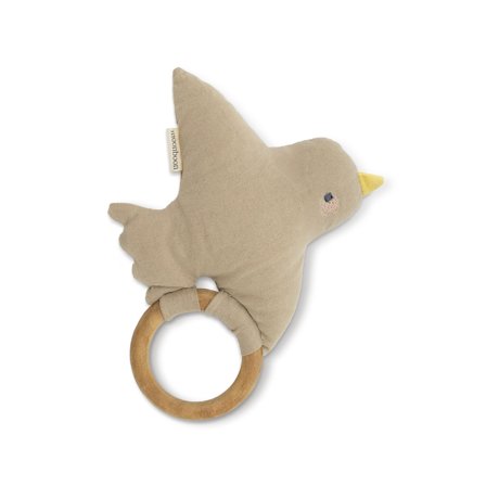 Baby Rassel mit süßem, weichem Vogel auf einem glatten Holzring