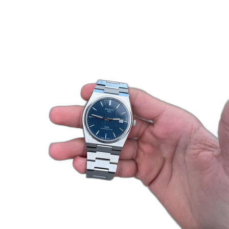 Silverfärgad klocka med blå urtavla från Tissot