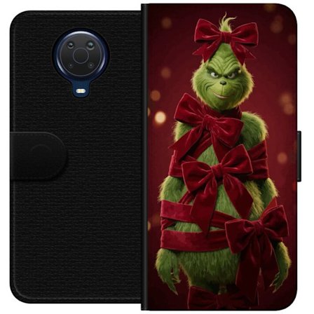 Yhteensopiva Lompakkokotelo Nokia Nokia G20 Grinchi-hahmo koristeltu punaisilla samettinauhoilla juhlavassa studiossa, leikkisällä ja humoristisella