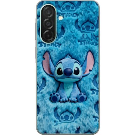 Kompatibelt Mobildeksel til Samsung Galaxy A26 Stitch sitter på fluffy blått mønster med sitt ansikt og ører gjentatt som tekstur, noe som skaper et s