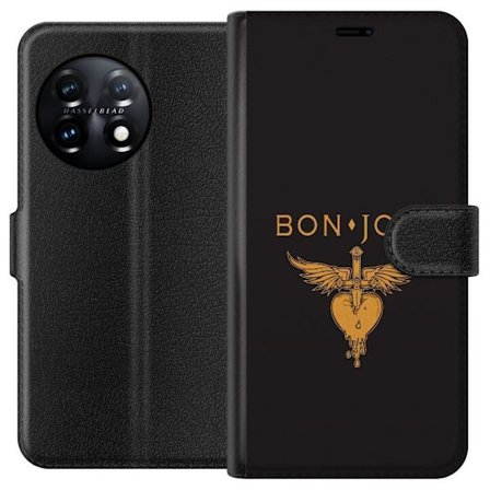 Kompatibelt Plånboksfodral till OnePlus 11R Ikonisk musikillustration med bevingat hjärta och dolk i guldtoner på mörk bakgrund, kraftfull och sym