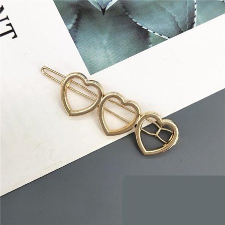 Håndlaget gullbelagt hårklipshjerte med vinger