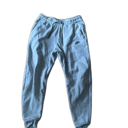 Grå mjukisbyxor från Nike med dragkedja