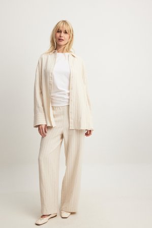 NA-KD Pantalon en lin mélangé à taille mi-haute élastique - Pantalons en lin - Beige/Rayé - EU 38