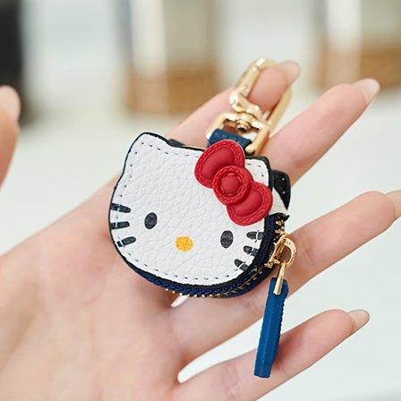 Charmerende lille opbevaringspose med Hello Kitty, perfekt til at holde dine hovedtelefoner, adgangskort og mønter organiseret.