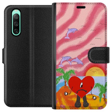 Kompatibelt Lommeboketui til Sony Xperia 10 IV Bad Bunny i en fargerik quiltet jakke med hjertemønster og solbriller i moderne gatestil