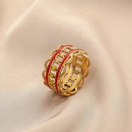 Unikt ringmønster med blå eller rød ståldetalj