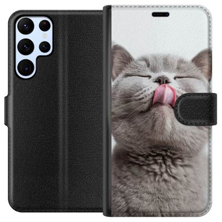 Kompatibelt Lommeboketui til Samsung Samsung Galaxy S24 Ultra Nærbilde av søt grå katt med tungen ute, sjarmerende dyrsmotiv perfekt for katteelske