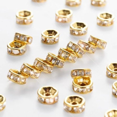 6 mm strassringe/afstandsstykker, guld/klar, 50 guld