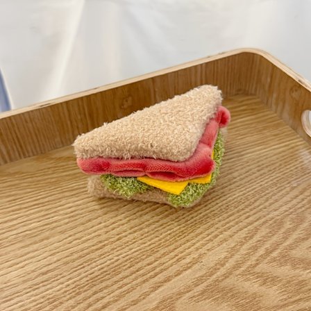 Yndig udstoppet legetøj i form af en hamburger, perfekt til at dekorere dit skrivebord eller hjem. Denne charmerende sandwichplys er en dejlig gave 