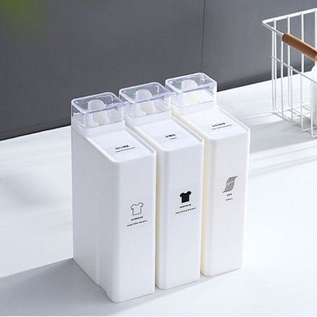 Hvit vaskemiddelbeholder for vaskemiddel