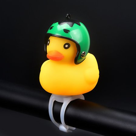 Vindbrytande anka vägcykelklocka liten anka gul ankhjälm barn som cyklar med hjälmhornljus