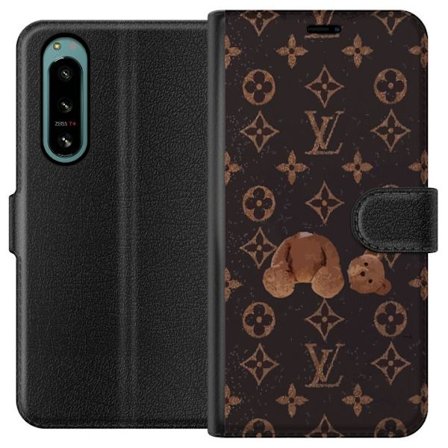 Yhteensopiva Lompakkokotelo Sony Sony Xperia 5 IV Ylellinen monogrammikuvio rikkinäisellä nalletaustalla pimeässä muotiestetiikassa