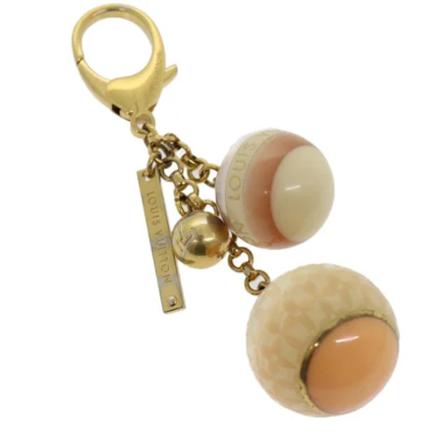 Louis Vuitton Vintage, Pre-owned Plastic key-holders Beige, unisex, Maat:ONE Size
