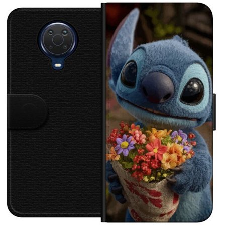 Kompatibel Tegnebogsetui til Nokia Nokia G20 Sød blå figur med store øjne, der holder en farverig buket i en varm og kær stil