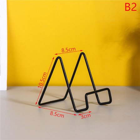 Musta kultainen teline pöydälle säilytyshylly