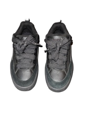 Svarta Puma sneakers i skinn och mocka