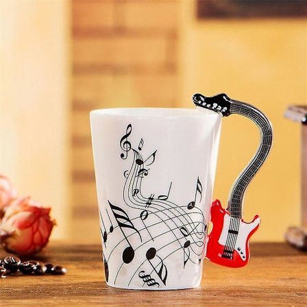 Keramisk krus med musikkinstrument-motiv - Julegave