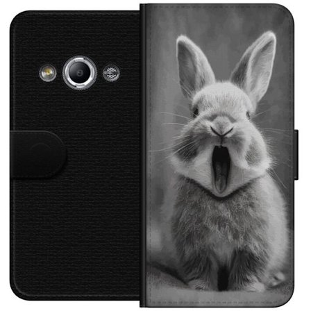 Kompatibelt Lommeboketui til Samsung Galaxy Xcover 3 Forlokkende svart og hvit kanin sitter forovervendt med munnen åpen som om den gjesper, noe som