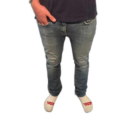 Blå Acne Studios jeans med slitningar