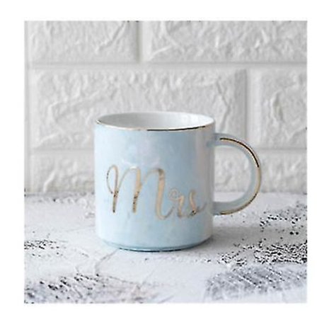 Luksusmuotoillut marmoroidut keramiikkamukit kultapinnoitteella, pariskunnan lahja