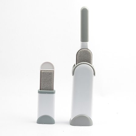 Liten grå husdjursrengöringsverktyg borttagare borste bindningsenhet