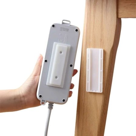 Selvklæbende holder til stikkontakt