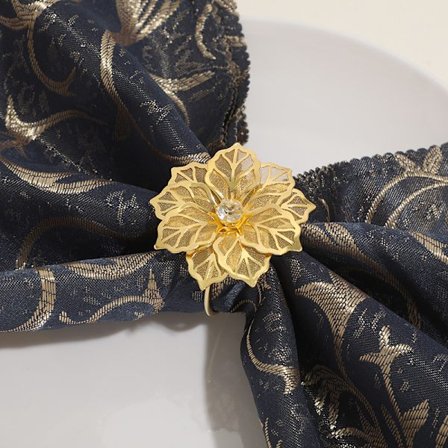 Sæt med 12 servietringe i legering med hul blomst