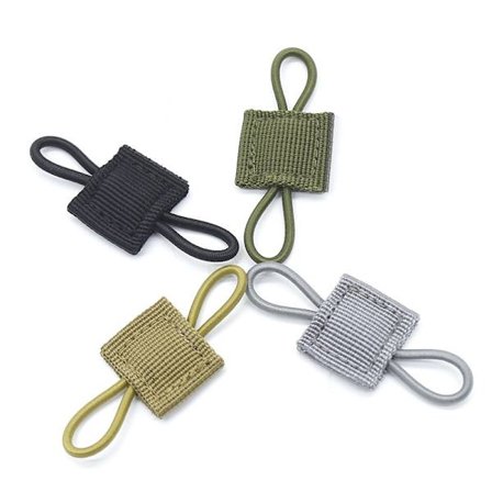 Taktiskt spänne med flera hål för rep