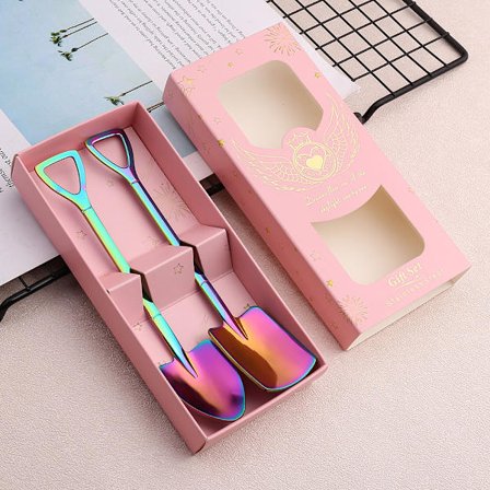 Rostfria skedar i form av spade, 2 st teskedar (regnbåge)